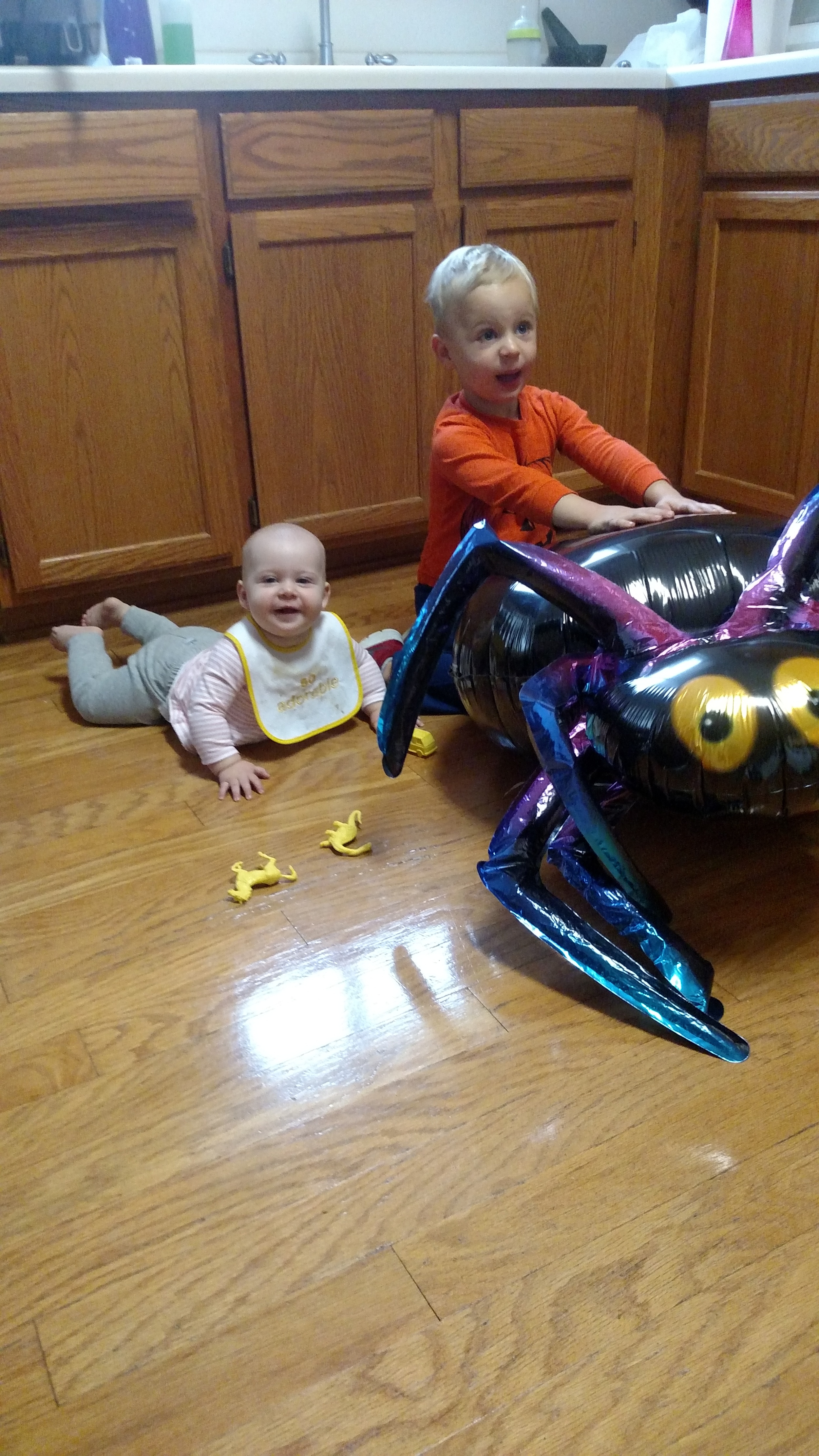 Young children playing together in a home childcare setting